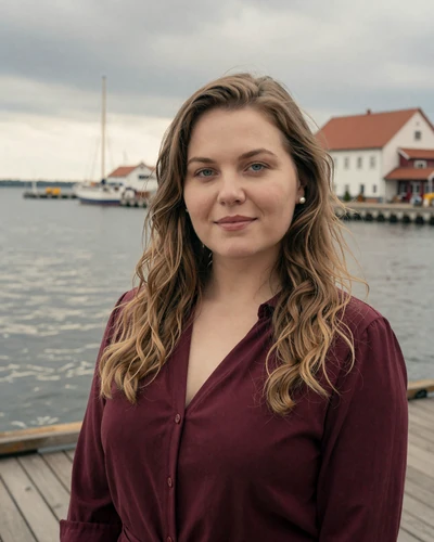 Rugile, 32, Lithuanian woman with dark blonde hair at Klaipeda harbor
