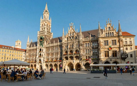 Munich Marienplatz with the New Town Hall and outdoor cafes - traditional Bavarian dating culture