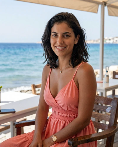 Maria, 26, Cypriot woman from Limassol at a seaside cafe terrace