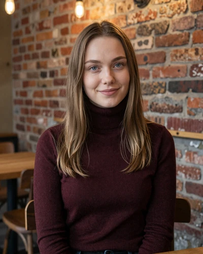 Elina, a 26-year-old Latvian woman in a cozy Riga old town cafe with warm lighting