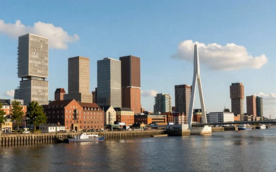 Rotterdam skyline featuring the Erasmus Bridge and modern architecture along the harbor