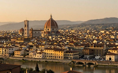 Florence skyline with the Duomo cathedral dome at sunset and terracotta rooftops across the Tuscan city