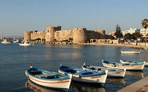 Paphos Cyprus harbor with medieval castle and colorful fishing boats
