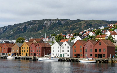 Bergen Bryggen colorful wooden waterfront houses with mountains in background