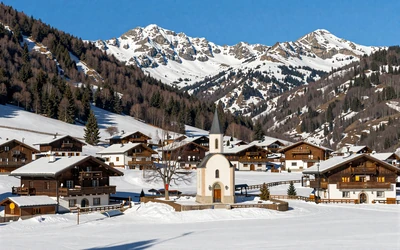 Canillo parish in Andorra with ski resort and charming mountain chapel among alpine forests